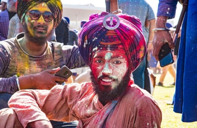A young sikh man smeared in the colours of holi, waiting for the hola mohalla festivities to begin at anandpur sahib!