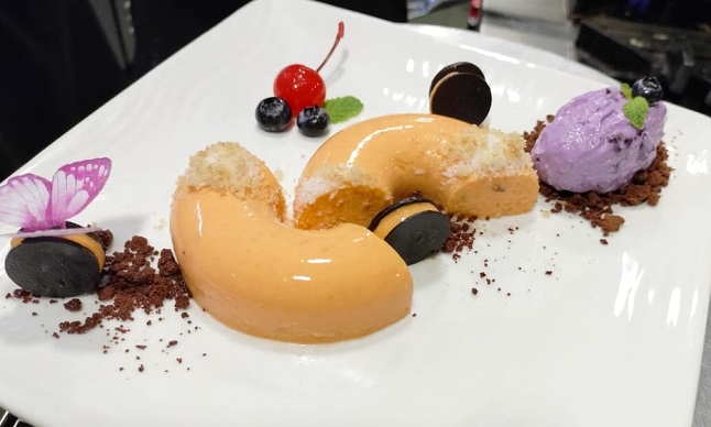 Carrot coconut kulfi pudding with blueberry quenelle - butterfly high.