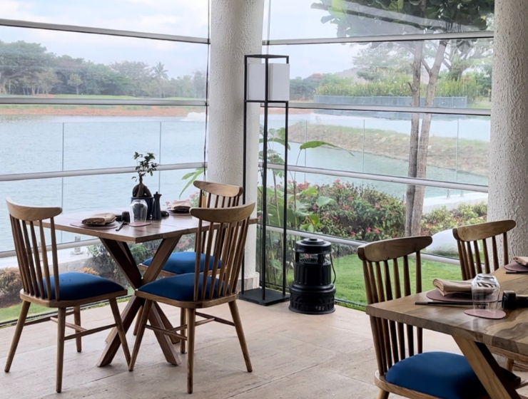 The outdoor seating deck at east the asian living room at jw marriott bengaluru.