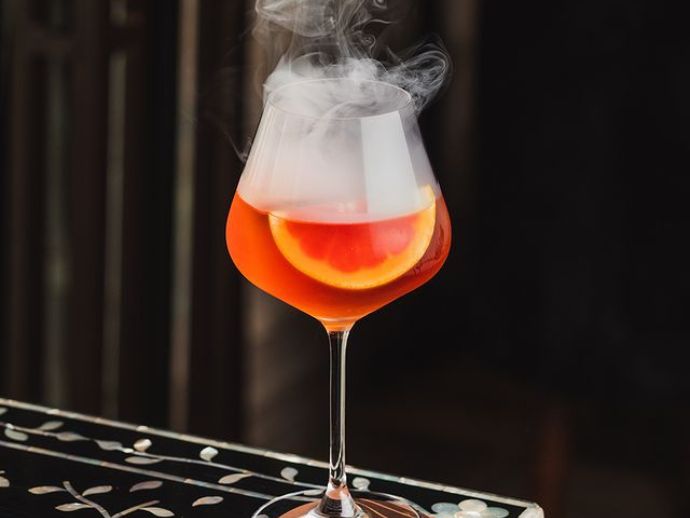 Christmas cocktail sst: smoked swirl & tonic at sette mara, st. Regis mumbai. Image: instagram.